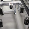pallet stop and locating device on a conveyor