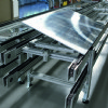 Lift and tilt device for pallet handling covneyors